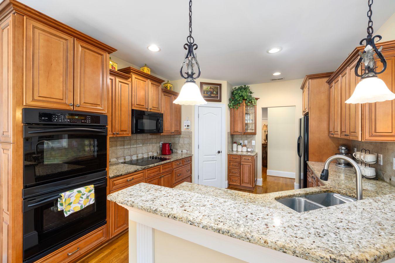 Kitchen with wooden cabinets and granite countertops, reflecting typical countertop installation cost